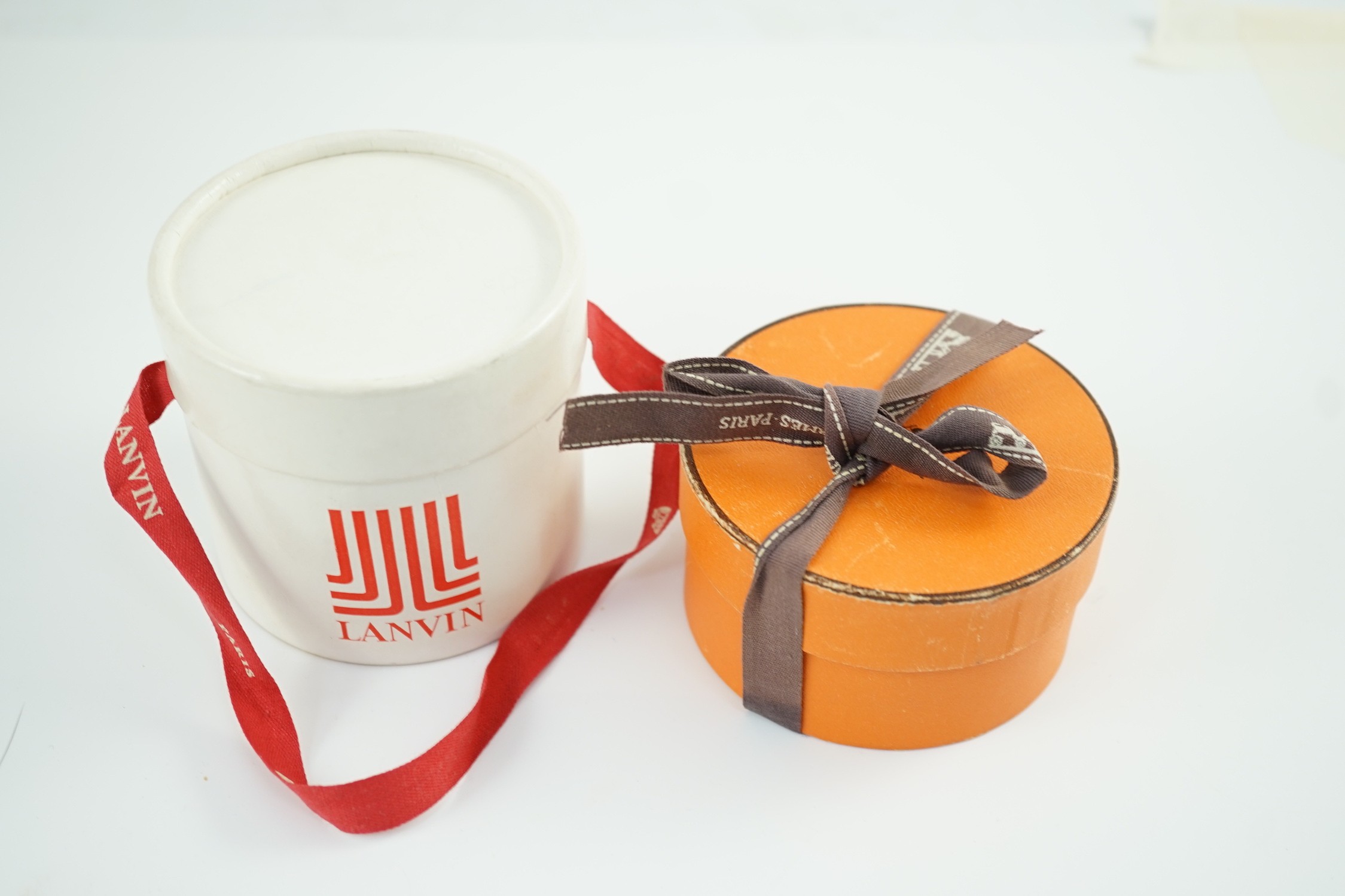 A boxed pair of Hermes enamelled bracelets and an unsigned bracelet in Lanvin box